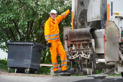 Construction site with waste removal services in action